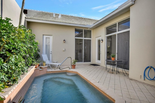 view of swimming pool featuring a hot tub and a wooden deck