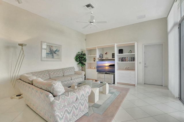 tiled living room featuring ceiling fan