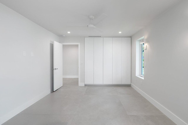 unfurnished bedroom featuring ceiling fan