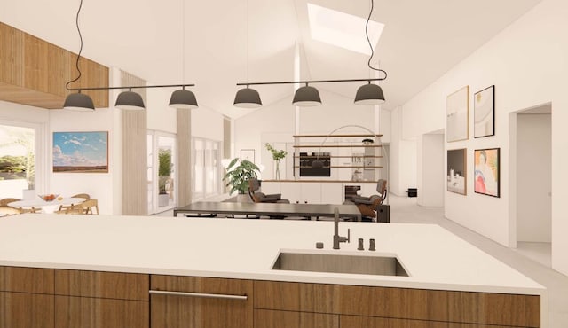 kitchen featuring sink, pendant lighting, and lofted ceiling