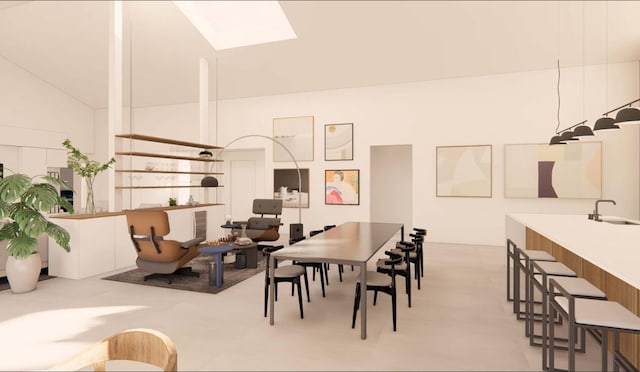 dining room featuring sink and vaulted ceiling with skylight