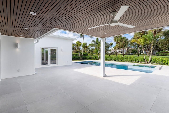 view of swimming pool featuring ceiling fan, french doors, an in ground hot tub, and a patio