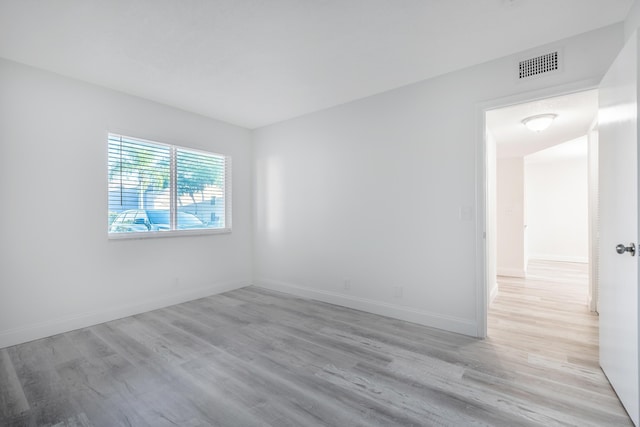 spare room with light wood-type flooring