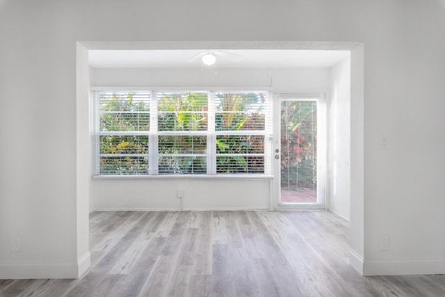 unfurnished room with light wood-type flooring