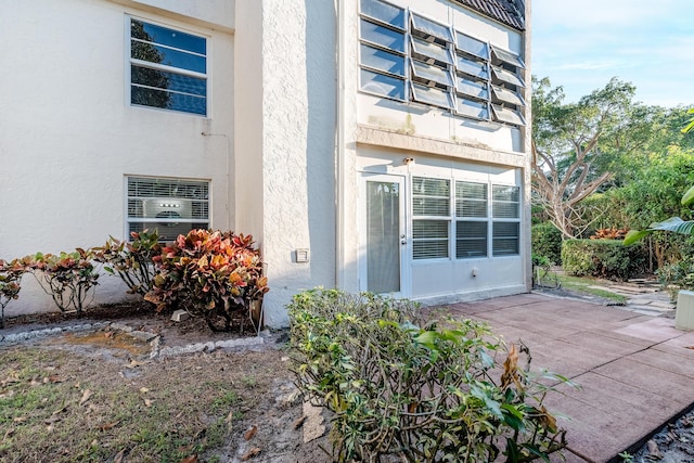 entrance to property with a patio area