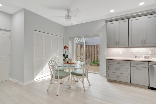 dining room with ceiling fan and light wood-type flooring