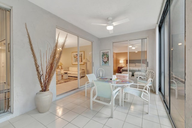 sunroom featuring ceiling fan