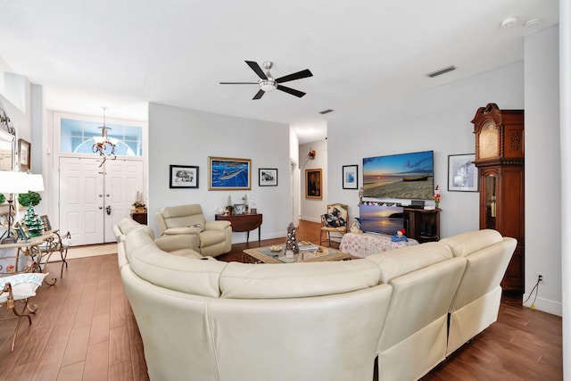 living room featuring hardwood / wood-style floors and ceiling fan