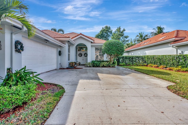 mediterranean / spanish-style home featuring a garage