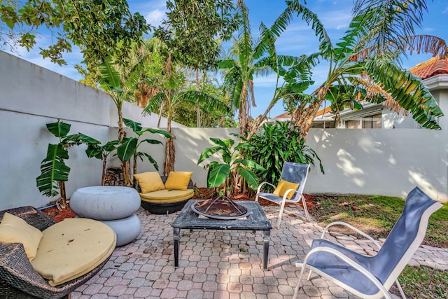 view of patio featuring a fire pit