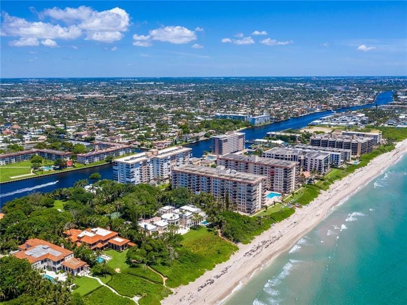 aerial view with a view of the beach and a water view