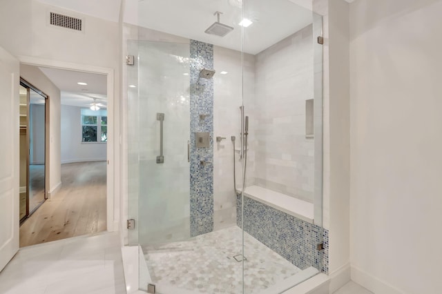 bathroom featuring tile patterned flooring, walk in shower, and ceiling fan