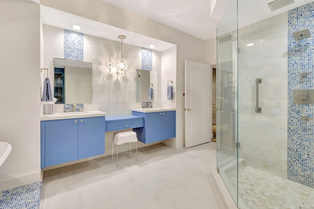 bathroom with a chandelier, vanity, walk in shower, and tile patterned flooring