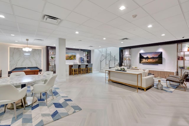 living room with billiards and light parquet floors