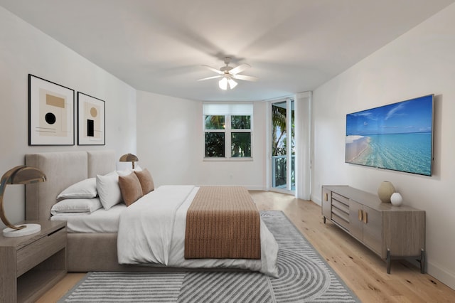 bedroom with ceiling fan, light hardwood / wood-style floors, and access to exterior