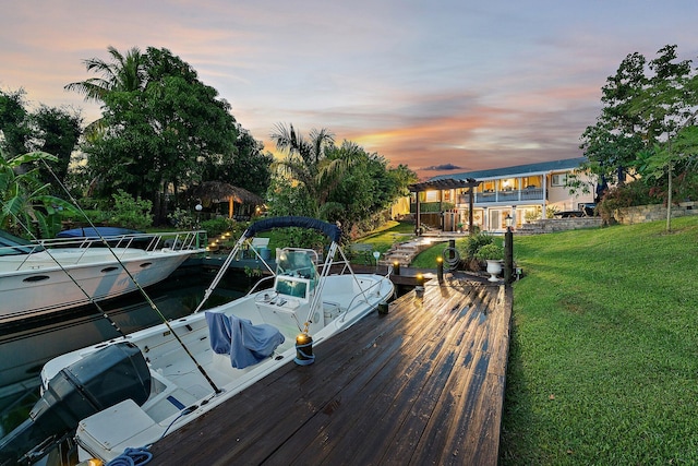 dock area featuring a lawn and a pergola