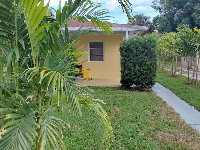 view of property exterior featuring a yard