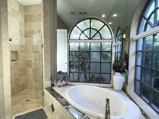 bathroom featuring plus walk in shower and vaulted ceiling