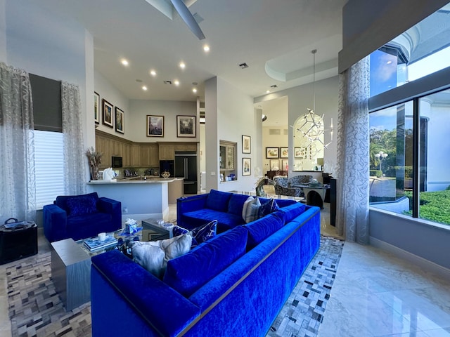 living room with a towering ceiling