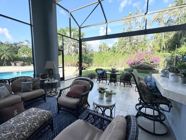 view of patio featuring glass enclosure and an outdoor living space