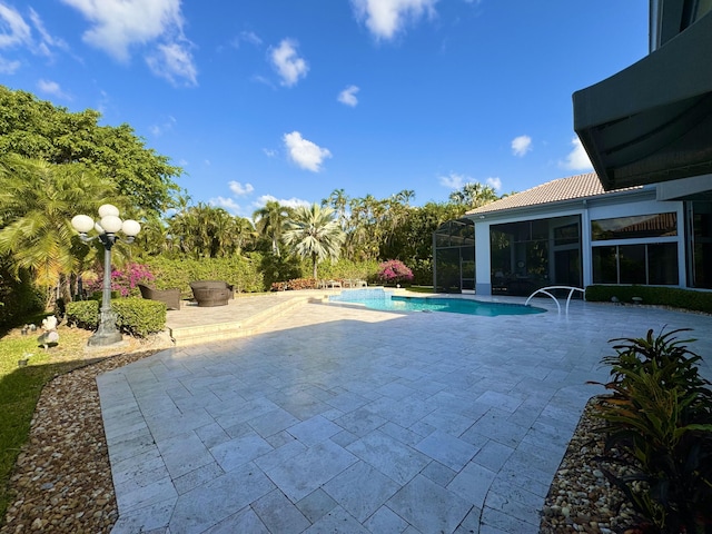 view of swimming pool featuring a patio area