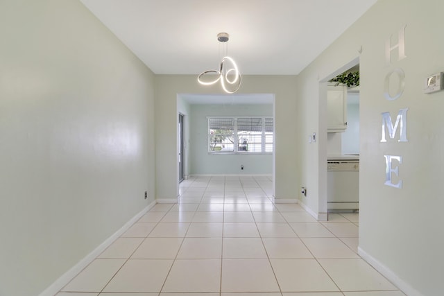 unfurnished dining area with light tile patterned floors and a notable chandelier