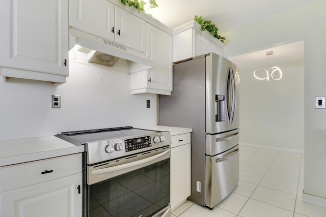 kitchen with white cabinets, light tile patterned flooring, appliances with stainless steel finishes, and pendant lighting