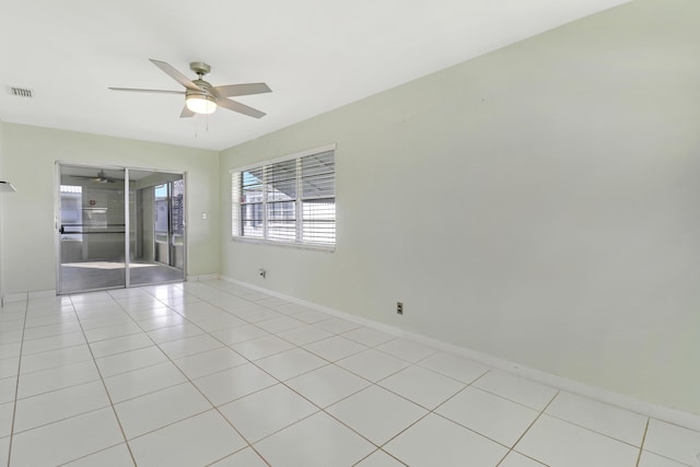 unfurnished room featuring ceiling fan and light tile patterned flooring