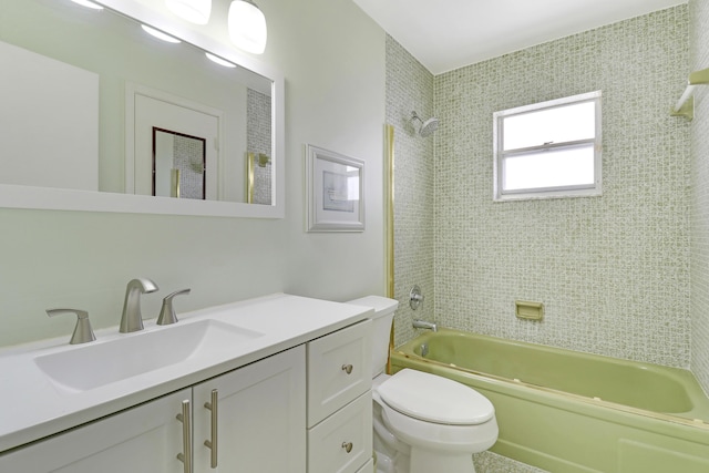 full bathroom featuring vanity, toilet, and tiled shower / bath