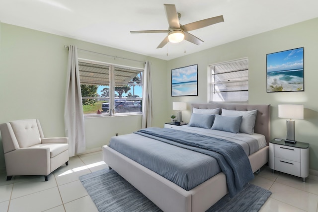 tiled bedroom featuring ceiling fan