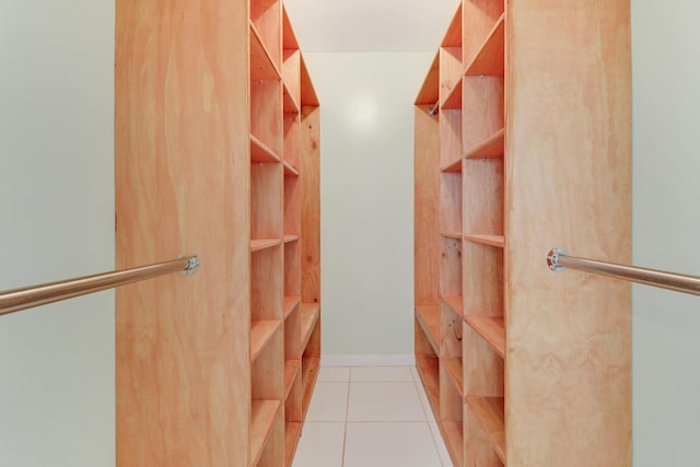 walk in closet featuring light tile patterned flooring