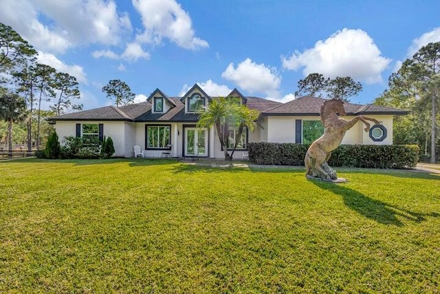 view of front of property featuring a front yard and stucco siding