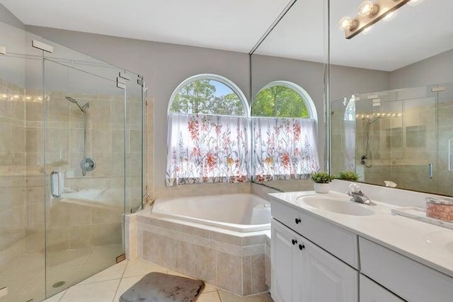 bathroom featuring tile patterned floors, separate shower and tub, and vanity