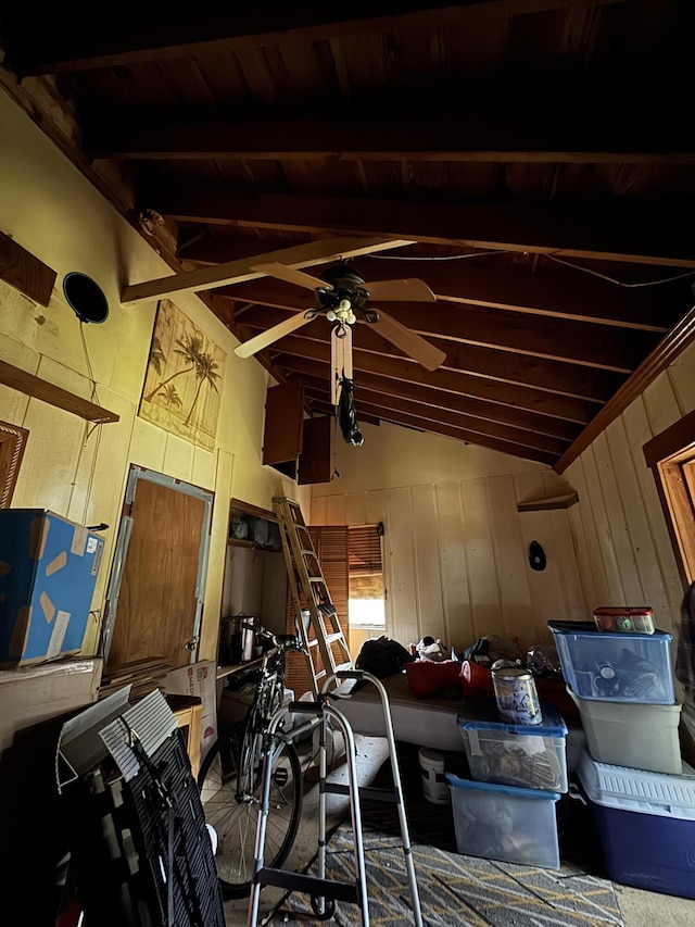 miscellaneous room featuring ceiling fan, wood ceiling, wood walls, and lofted ceiling with beams