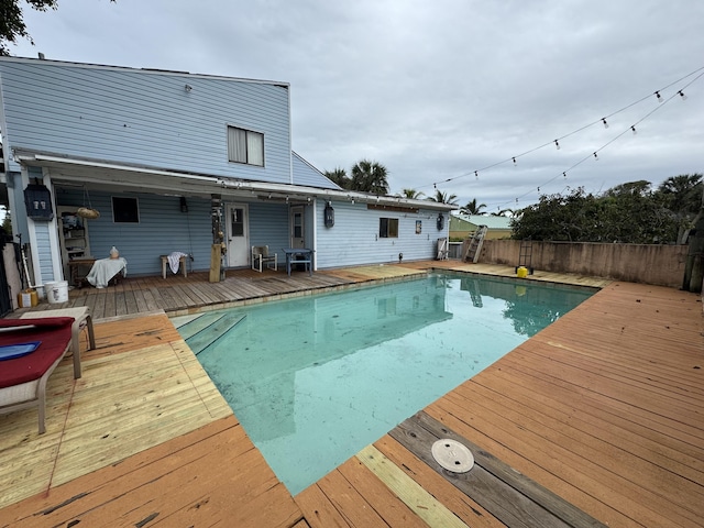 view of swimming pool featuring a deck