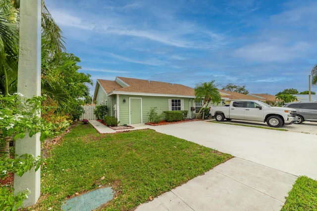 ranch-style house with a front lawn