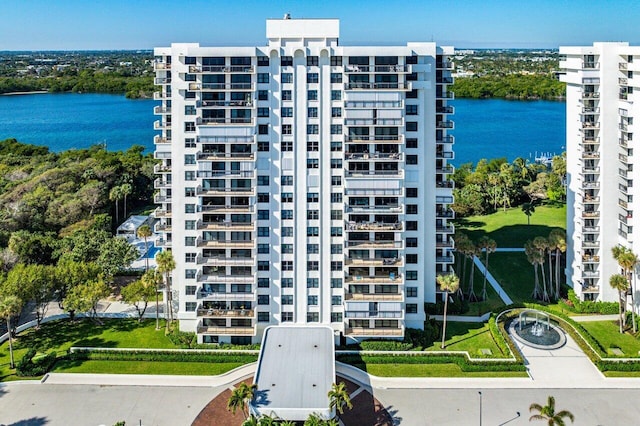 view of building exterior with a water view