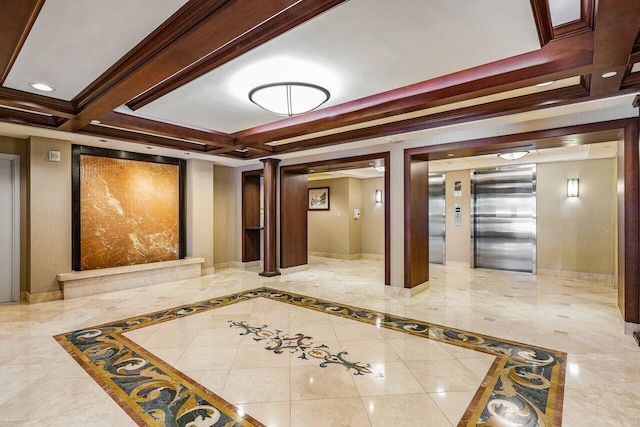 corridor with ornate columns, crown molding, and elevator