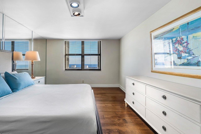 bedroom featuring dark hardwood / wood-style flooring