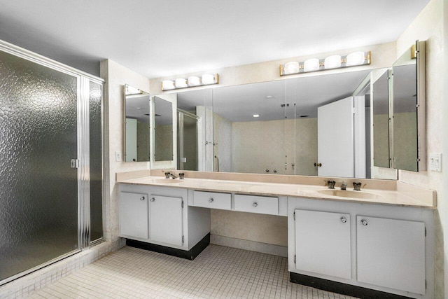 bathroom featuring vanity, tile patterned floors, and an enclosed shower