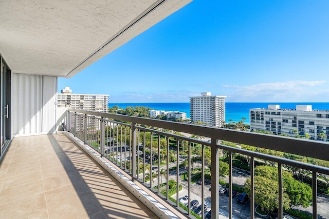 balcony featuring a water view