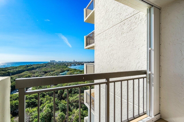 balcony featuring a water view