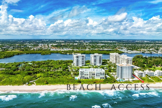 bird's eye view featuring a water view and a view of the beach