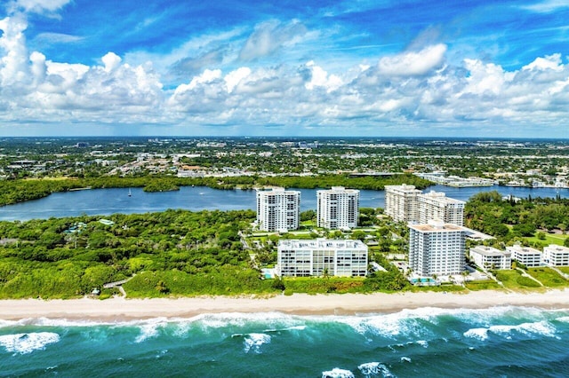 drone / aerial view featuring a view of the beach and a water view