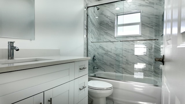 full bathroom featuring vanity, toilet, and enclosed tub / shower combo