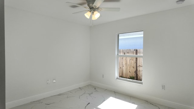 spare room featuring ceiling fan