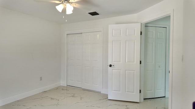 unfurnished bedroom featuring ceiling fan