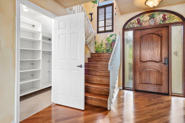 entryway with hardwood / wood-style flooring