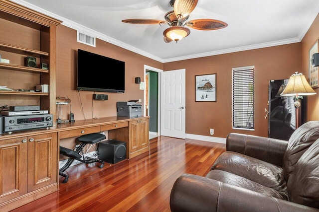 home office featuring dark wood-type flooring, ceiling fan, and ornamental molding