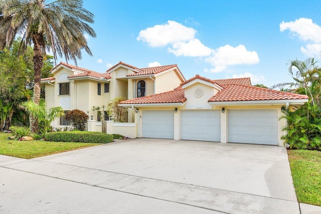 mediterranean / spanish-style home featuring a garage